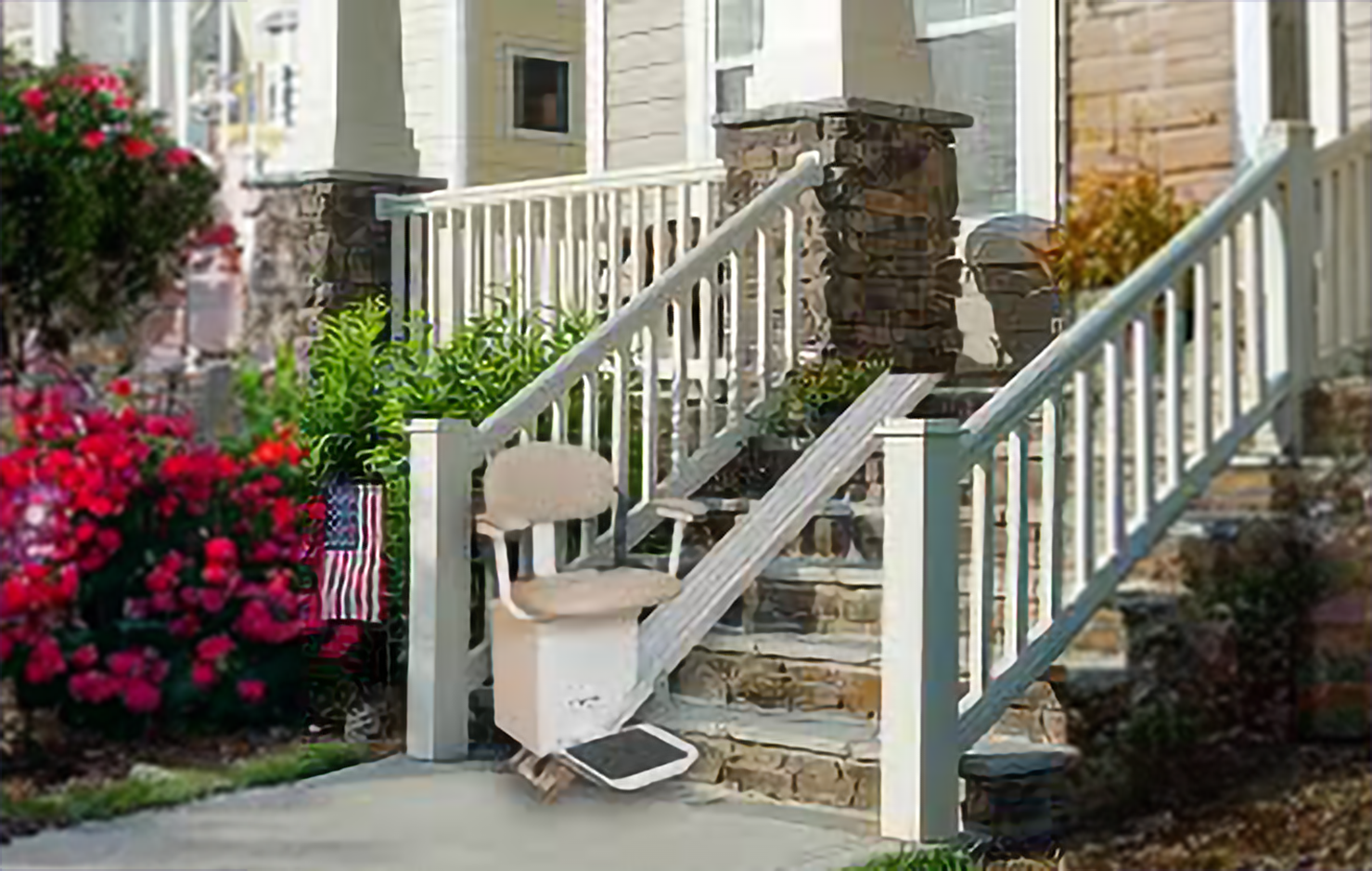 Outdoor stair lift leading up to front door of home