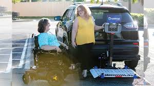 woman using a Hitch Vehicle Lift on a van