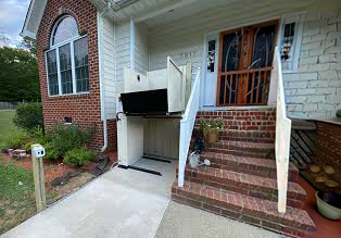 House with an exterior weather proof platform lift
