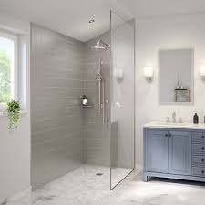 Modern handicapped accessible  bathroom with shower enclosure, vanity, and mirror.

